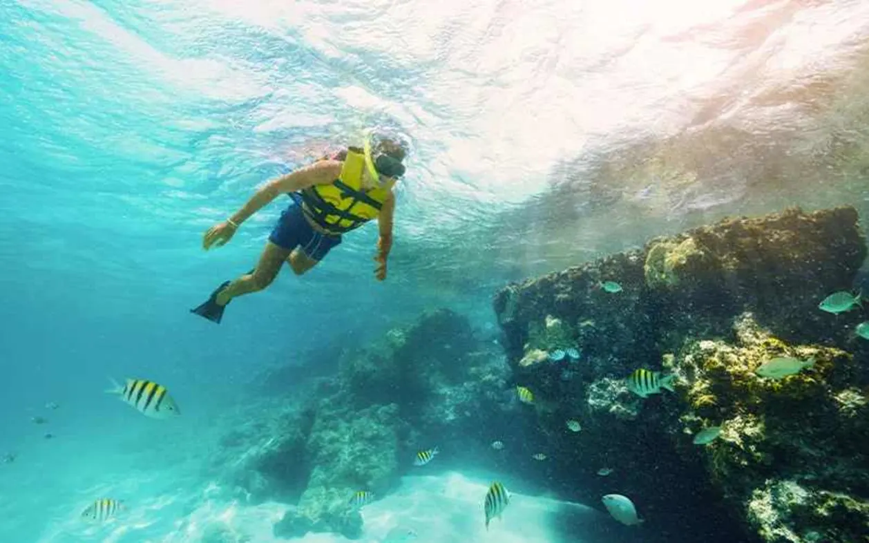 Woman snorkeling in Playa Mujeres